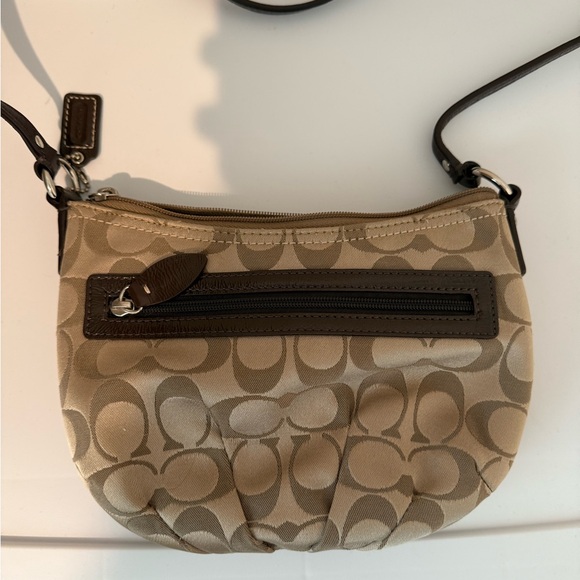Coach Tan and Brown Crossbody Bag with Signature Pattern and Curved Shape - Picture 1 of 4